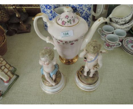 A pair of early ceramic cherub figures in a Meissen style etc
