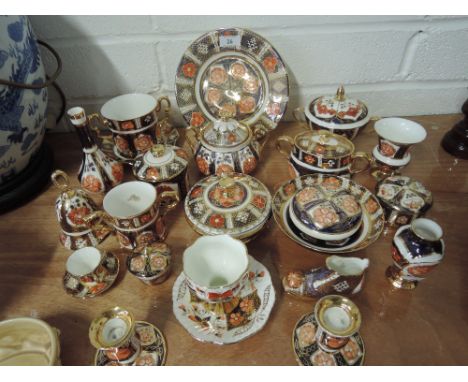 A selection of trinkets and ceramics in an Imari style with Lancashire rose in a Crown Derby style signed M M Barritt 1985