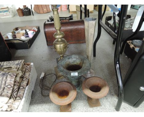 A selection of cast planters and long stem brass table lamp