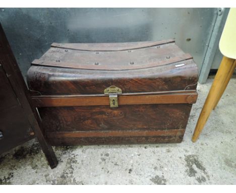 A vintage metal travel trunk and selection of stoneware storage drawers