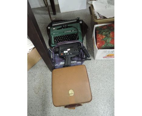 A vintage smith Corona type writer in green also Sankyo sound xl-40s and Arista typewriter  