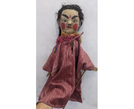 An early/mid 20th century oriental hand puppet with a painted face and bamboo handleLocationIf there is no condition report s