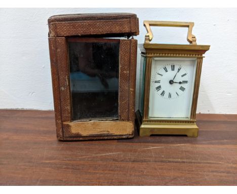 An early 20th century brass carriage clock in a carrying caseLocation: If there is no condition report shown, please request