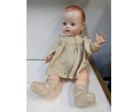 A 1950's Pedigree doll with jointed arms & legs blue sleeping eyes and open mouth in original clothes with non functioning sp