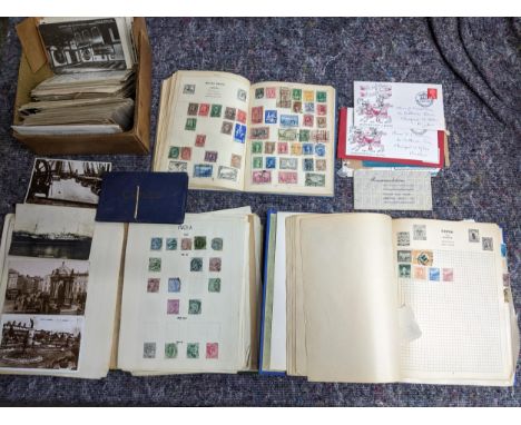 A selection of vintage stamps and postcards to include three stamp albums of world stamps including China, India, Canada and 