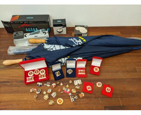Football related enamel badges to include Manchester United, Chelsea, Tottenham, three motor related umbrellas, and an airbru
