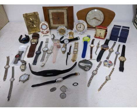 A mixed lot of various wristwatches to include a Buler ladies cocktail watch, and various mantel clocks to include a Waterfor