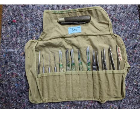 A vintage mid-century medical scalpel instrument set in canvas slip case with name tag for Nancy Haslam, along with a pocket 