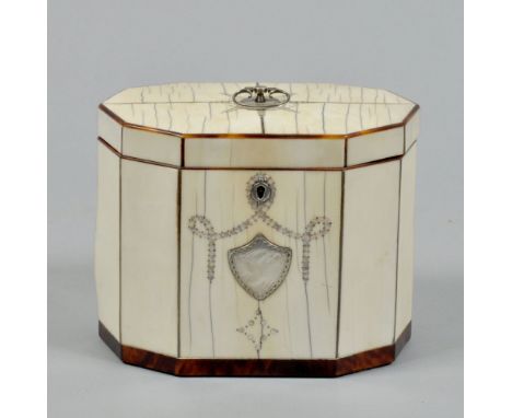 A George III ivory two compartment tea caddy of decagonal form, with silver and mother of pearl swag and shield decoration wi