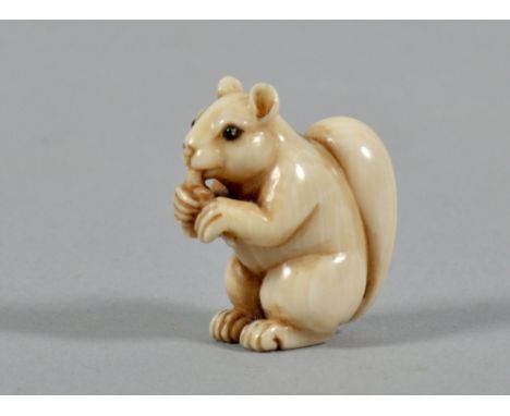 A 19c ivory figure netsuke carved as a squirrel, with black incised signature to base, 1"h. 