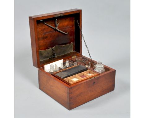 A late Georgian mahogany apothecary's box, fitted with a cylindrical brass cased heater lamp, a thermometer and hydrometer, a