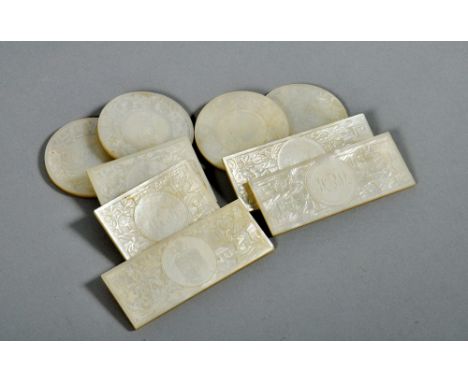A collection of nine 19c Oriental mother of pearl counters engraved with figures, musical and village scenes and with circula