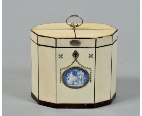 A George III ivory tea caddy of decagonal form, with a Wedgwood blue and white parian oval classical motif within a silver pi