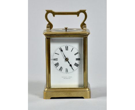 A late 19c French carriage clock marked 'R & Co, Paris' and having a striking and hour repeating movement on a gong. The move