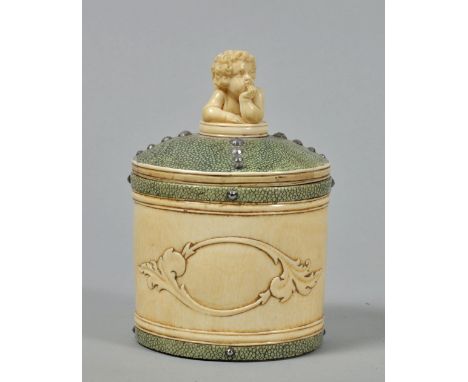 A late 19/20th century tea caddy encased in ivory and shagreen with cherub finial and cut steel beading, 4" x 6". 