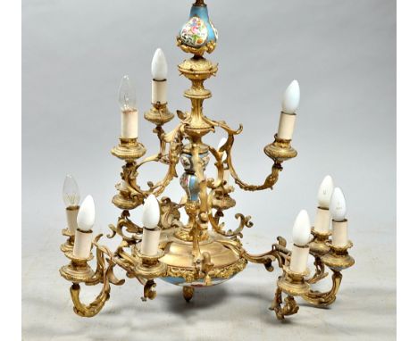 An early 20c eight branch gilt metal and ceramic chandelier electrolier, 24"diam, 28"h. 