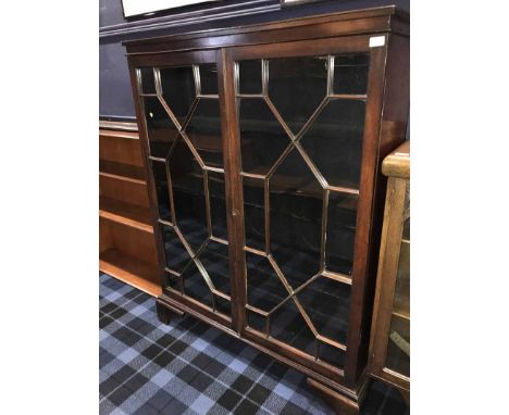 MAHOGANY TWO DOOR ASTRAL GLAZED BOOKCASE ON BRACKET FEET