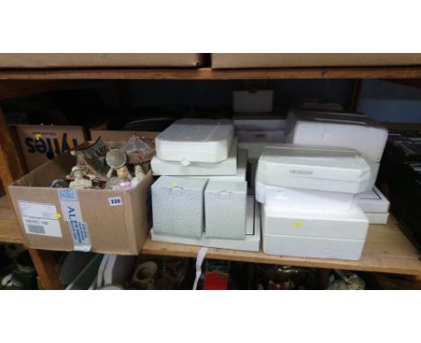 A shelf of figurines and picture plates etc.