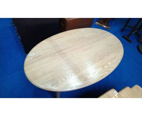 An Ercol oval coffee table. 120cm length