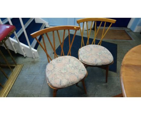 A set of four Ercol spindle back chairs