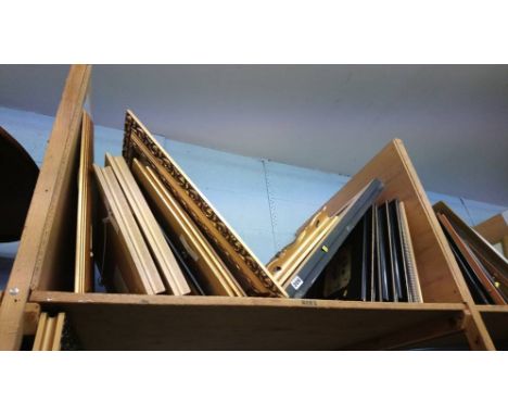 A shelf of prints etc.