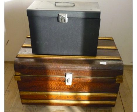 Vintage tin trunk with later added wheels 