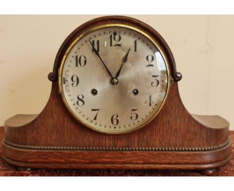 Early 20th C oak cased mantel clock with steel dial on four raised bun feet, the chiming movement marked H.A.C Made in Wurtte