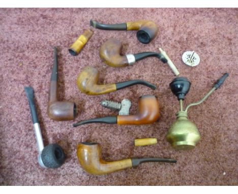 Collection of pipes and cheroot holders including amber tipped, a K&amp;P Peterson pipe etc 