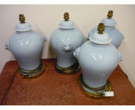 Set of four ceramic table lamps with lion mask handles 