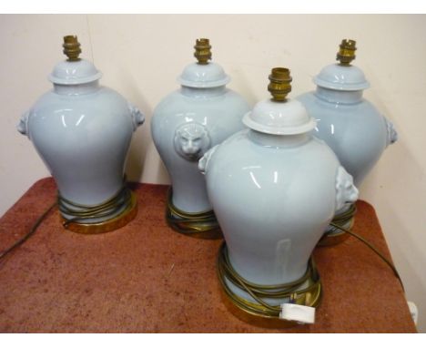 Set of four ceramic table lamps with lion mask handles 