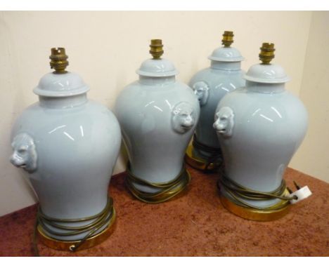 Set of four ceramic table lamps with lion mask handles 