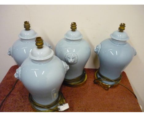 Set of four ceramic table lamps with lion mask handles 