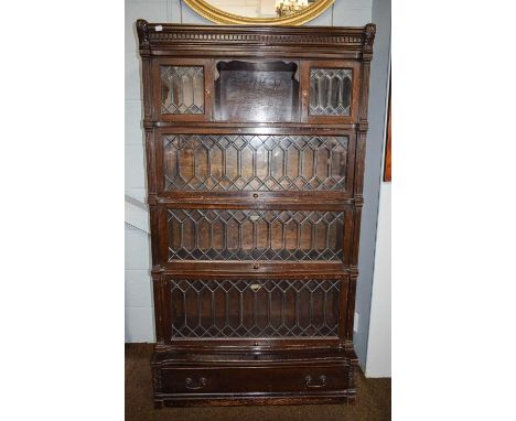 A Globe Wernicke &amp; Co. Ltd. Four Tier Sectional Bookcase, with leaded glass and base drawer, 90cm by 33cm by 161cm