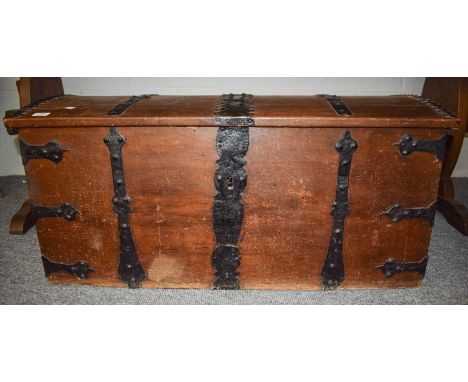 A 19th Century Metal Bound Dome Topped Oak Trunk, 104cm by 50cm by 47cm; together with two 19th-century provincial oak chairs
