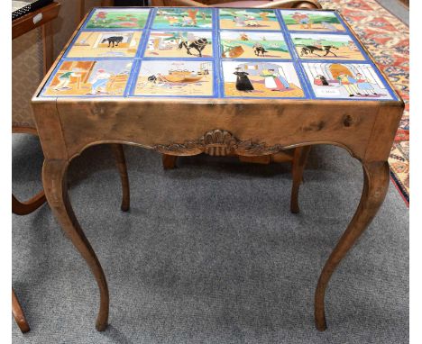 A 1920s Tile Inset Walnut Lamp Table, the twelve Arts &amp; Crafts style polychrome tiles possibly earlier, depicting a tradi