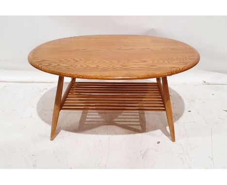 Ercol light elm-topped coffee table&nbsp;with beech magazine rack under, 44cm x 98cm x 83cm&nbsp;Condition ReportSome light s