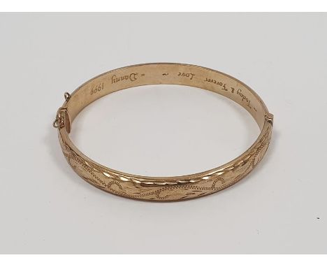 9ct gold bangle with engraved decoration, inscribed to the inside 'Today and Forever Love Danny 1999', 10g approx. Condition 