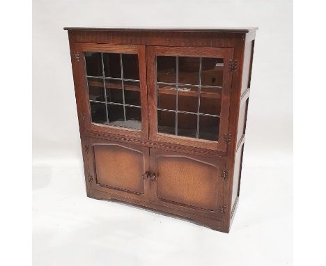 20th century oak cupboard, the rectangular top above two leaded glazed doors and two cupboard doors, on bracket feet, 107cm x