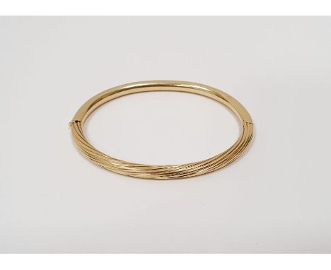 18 carat gold bangle&nbsp; marked 750 14.0gCondition ReportSome light surface scratches/scuffs, no dents. General wear and te