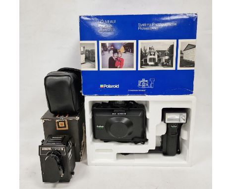 Vintage Polaroid Propack camera and flash, boxed with instructions together with a vintage Lubitel 166 b Lomo camera