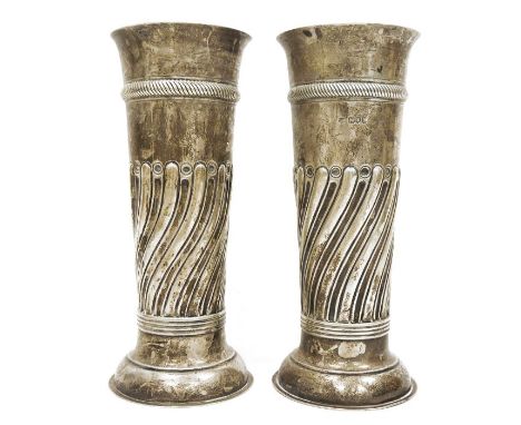 Pair of Victorian large silver vases, cylindrical repousse decorated on circular feet, London 1897 and 1898, makers mark WCJL