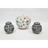 20th century lidded ovoid pot in the Chinese taste, decorated with butterflies and two ginger