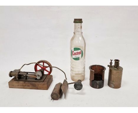 Vintage static steam engine and a vintage glass Castrol motor oil bottle (2)