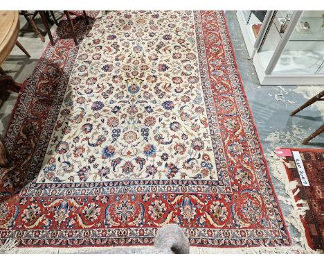 Eastern style cream ground carpet with central floral pattern with multiple herati and floral borders 320cm X 206cmCondition 