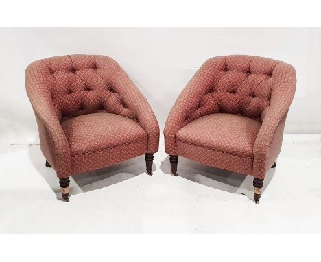 Pair of modern 20th century office reception chairs with button backs and plum floral upholstery on turned front legs to cast