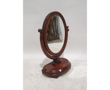 19th century dressing table mirror, the oval mirror in moulded frame, on shaped platform base