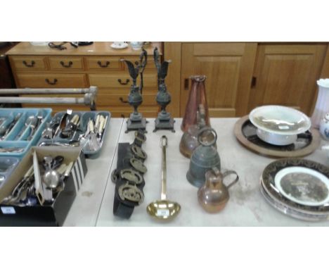 A 19th Century brass long handled ladle; a copper jug; a a pair of spelter ewers; a large horse brass etc.