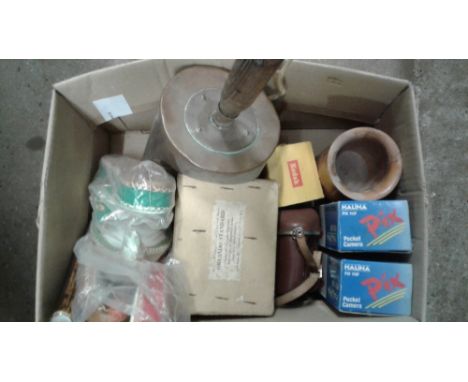 A box containing a copper coal shovel; a camera; pocket cameras etc.
