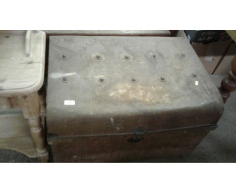 A tin trunk containing galvanised baths 