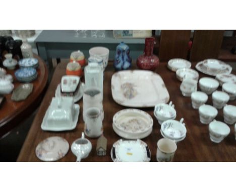 A Poole pottery jardinière; a Royal Doulton Bunnykins baby plate; two butter dishes; various jugs etc.